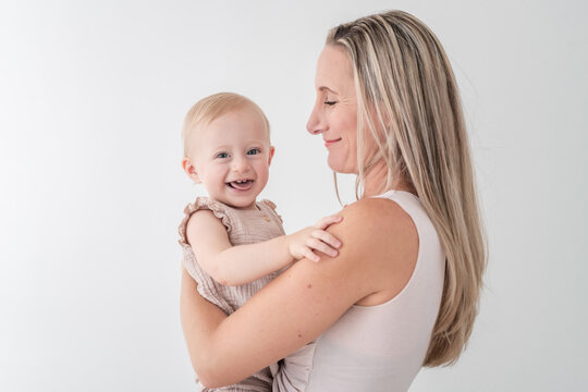 Girl Laughs With Mother