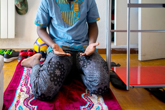 Black Muslim Praying At Home.