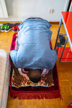 Black Muslim Praying At Home.