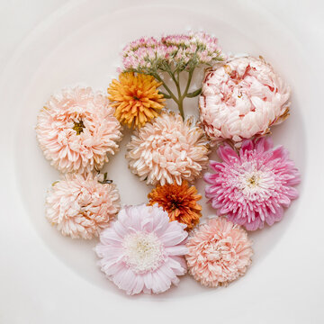 Fresh flowers in cowl with water