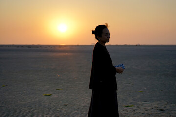 Pretty Asian women on outdoor picnic during the journey