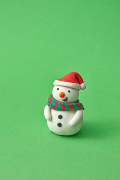Figure of Snowman handmade from colored plasticine.