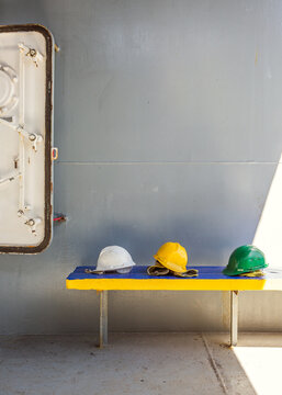 Workers helmets on a cargo ship