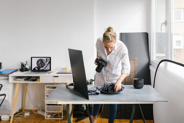 Female photographer working in a studio