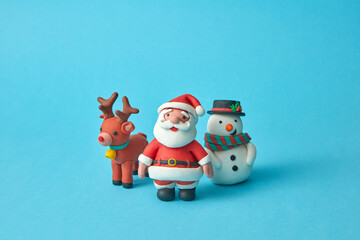 Craft plasticine Santa Claus with deer and Snowman.