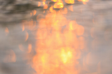 Abstract sunlight reflective on water background, Lights bokeh on water surface at sunset nature summer or spring ocean sea