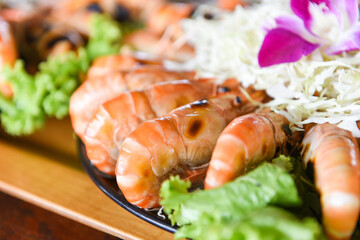 Grilled shrimp prawn with fresh vegetable and seafood sauce,  shrimps grilled serve on tray - seafood buffet Thai food