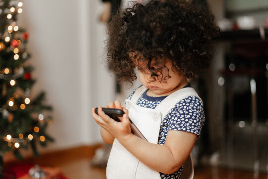 little girl using an android cellphone