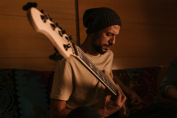 Bass player rehearsing at home.