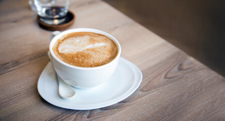 cappuccino coffee on table morning serve on ceramic cup