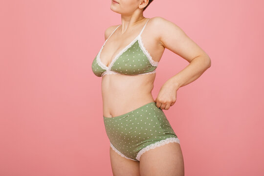 Non-binary person posing in lingerie