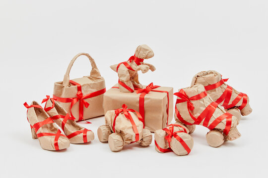 Set of different holiday gifts wrapped craft paper.