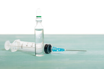 Medical vial and syringe isolated on white background, vaccination concept and disease treatments