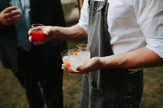 waiter serving different kind of drinks