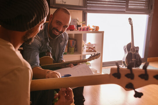 Musicians composing music at home