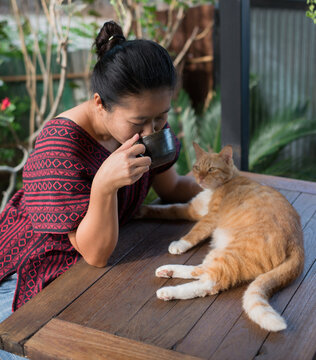 Asian woman and her cat