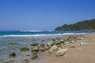 Tropical panorama view of Wanokaka beach with rocks, Lamboya, Sumba island, East Nusa Tenggara, Indonesia