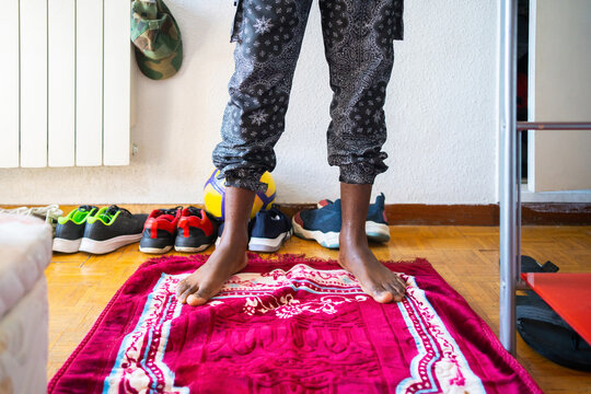 Black Muslim Praying At Home.