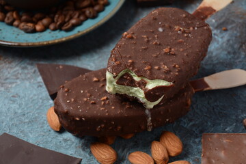 Chocolate flavor popsicle, almonds, coffee beans, and tasty chocolate pieces .