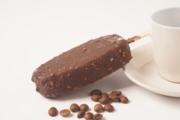 Chocolate and coffee flavor popsicle with white cup and coffee beans