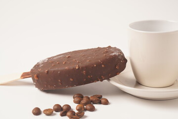 Chocolate and coffee flavor popsicle with white cup and coffee beans