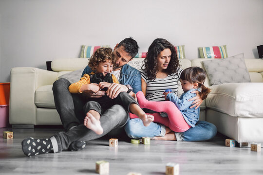 Parents playing with his children
