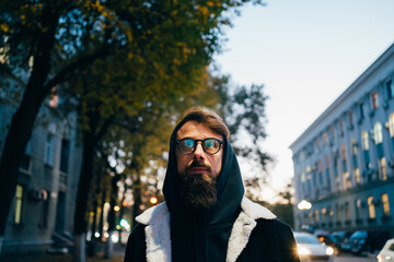 Young man in the city in the evening