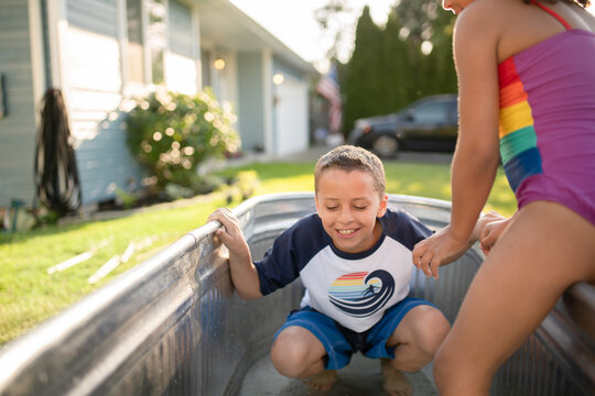 brother and sister in pool