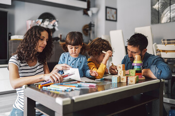 Parents drawing a picture with their children