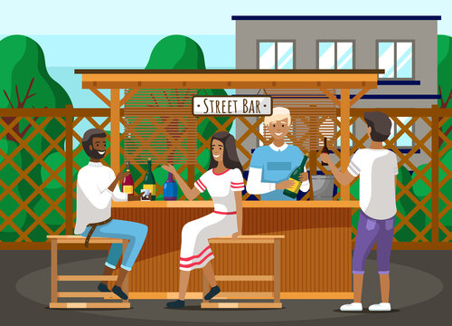 Guests relaxing in street outdoor bar. Bartender making alcohol coocktails for communicating people