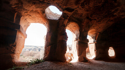 Turkey Achiksaray, suburb of Nevsehir. Ancient ruins of churches carved into sandy rocks....