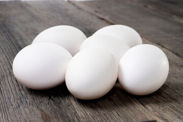 raw eggs on wood background.white egg