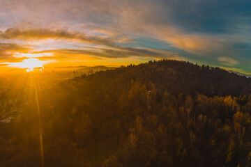 Naklejka na ściany i meble Early morning drone panorama photo of abandoned ski jump tower in Mostec, Ljubljana. Relic of an old ski jumping hill in the Slovenian city.