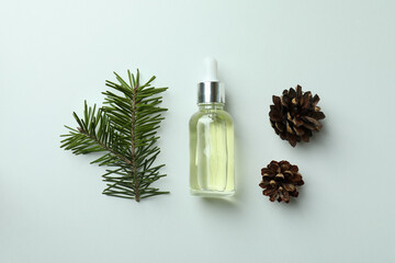 Flat lay with pine oil on white background