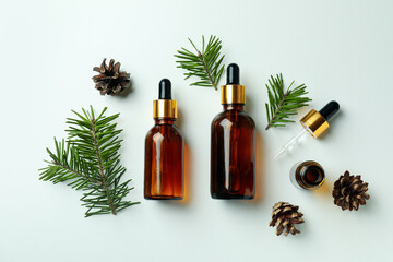 Flat lay with pine oil on white background