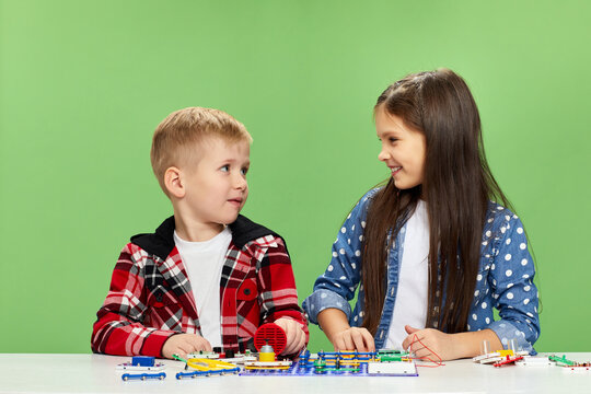 children playing with electronic constructor at studio