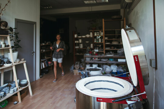 Female artisan makes ceramic products.