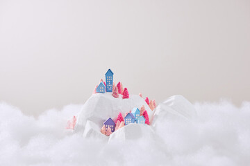 depicting a miniature snowy village, ideal for Christmas, New Year and Epiphany cards