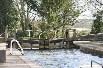 Mitre lock gates closed at a canal entrance in rural england
