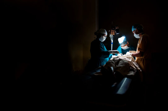 Medical Practitioners Making Surgery On Patient