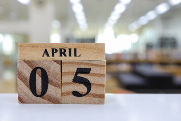 Day 5 of April month, Wooden calendar with date.