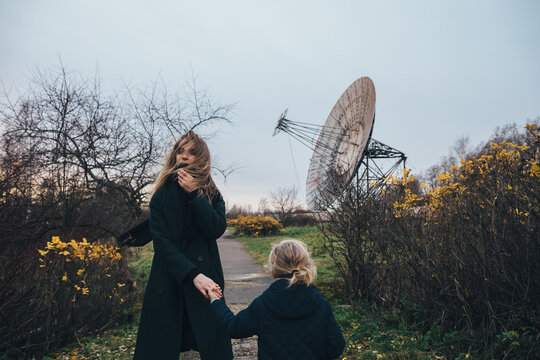 Woman and child at the satellite dish