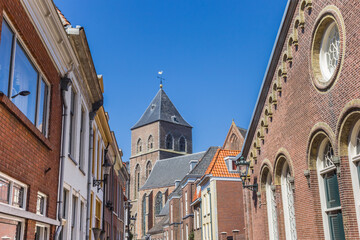Old houses and church tower in the center of Kampen, Netherlands