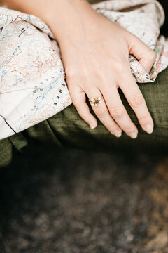 closeup of brides hand holding a map of Joshua Tree National park