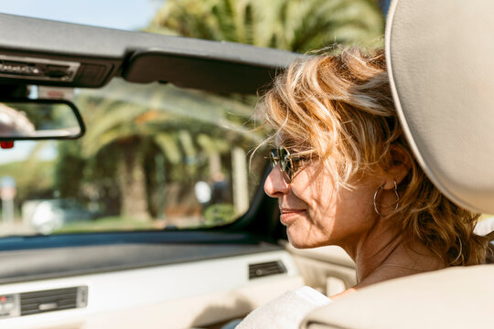 mature blond woman sitting in the passenger seat