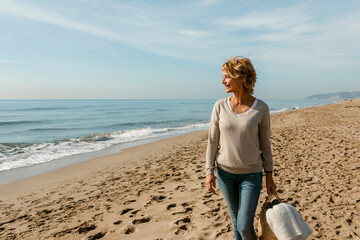 mature woman walking on the beach