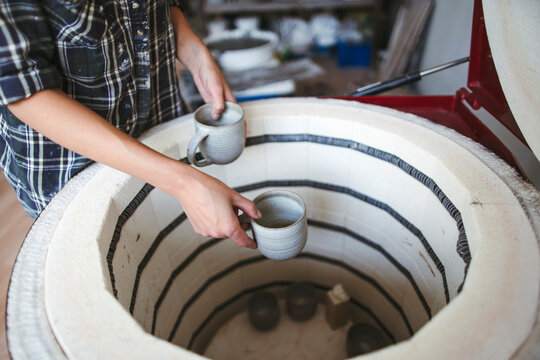 Female artisan makes ceramic products.