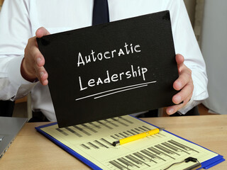 Business concept meaning Autocratic Leadership with inscription on the piece of paper.