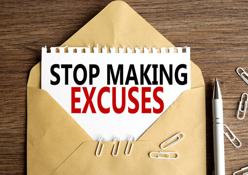 Stop Making Excuses.Text on white paper. on paper in an envelope on a wooden table.