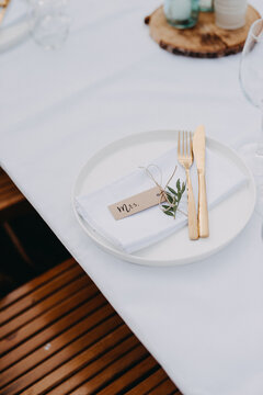 White plate with golden cutlery for Mrs.
